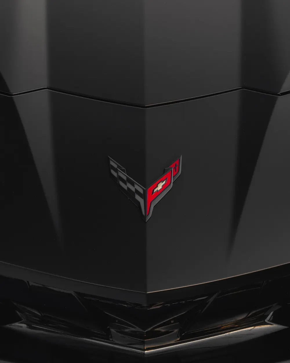 Black Corvette hood detail after paint protection film installation